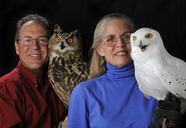Marcia and Mark Wilson holding owls