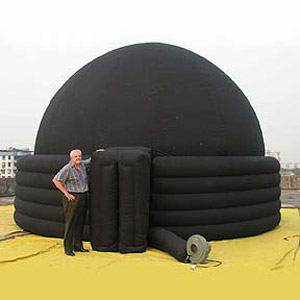 Inflatable planetarium dome with man in front