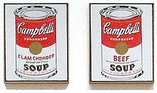 A pair of red and white Campbell's soup cans painted by Andy Warhol