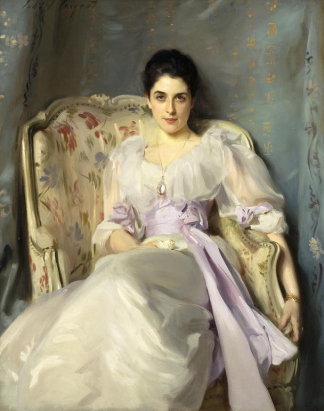 Seated woman in a white dress