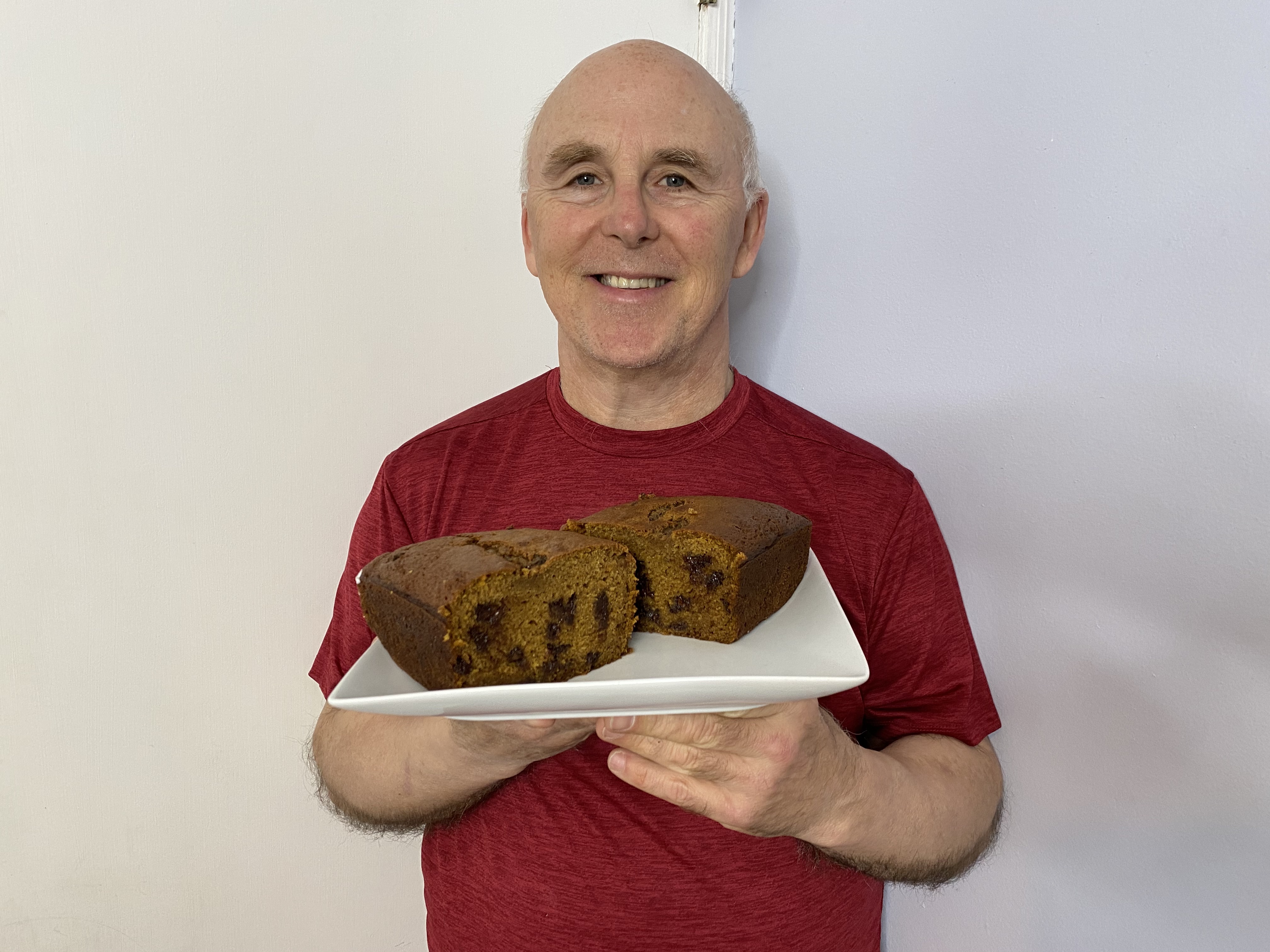 Chef Rob Scott holding a plate of his pumpkin bread