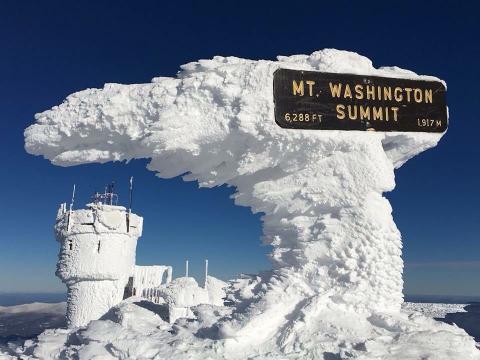 Snow encrusted tower on Mount Washington Summit