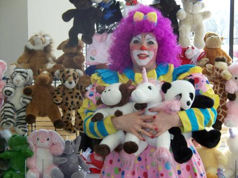 Clown with stuffed animals