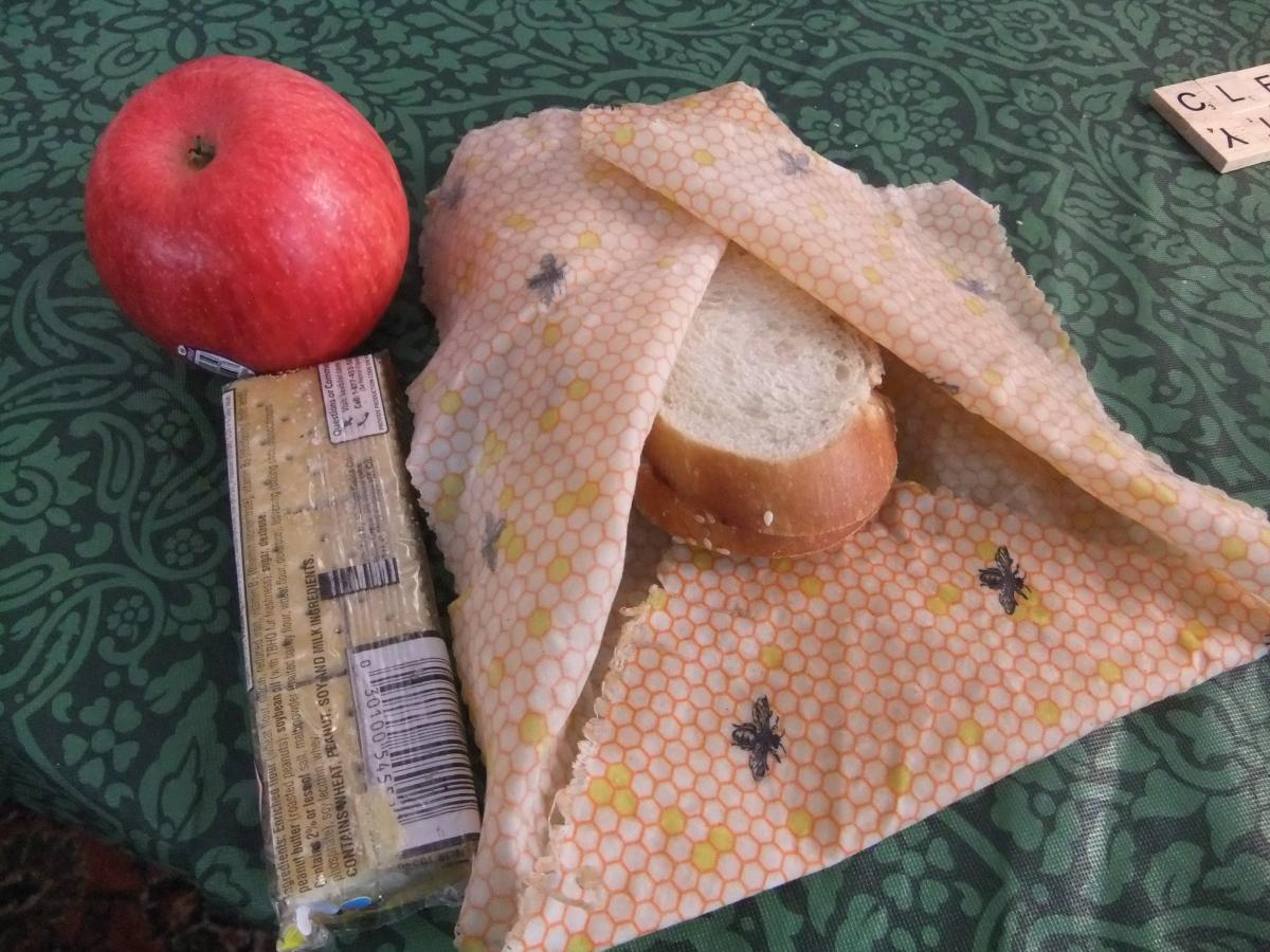 Beeswax wrapped sandwich, apple and crackers